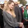 American actor and film producer Angelina Jolie, front left, greets Red Crecent workers during her visit to the Rafah border crossing between Egypt and the Gaza Strip in Rafah, Egypt, Friday, Jan. 2, 2026. (AP Photo/Mohamed Arafat)