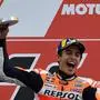 Repsol Honda Team's Spanish rider Marc Marquez celebrates with the trophy on the podium after winning the MotoGP race of the MotoGP Valencia Grand Prix at the Ricardo Tormo racetrack in Cheste near Valencia, on November 17, 2019. - World champion Marc Marquez clinched his 12th MotoGP victory of the season in final race in Valencia. (Photo by PIERRE-PHILIPPE MARCOU / AFP)