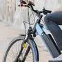 Close up man riding an e-bike