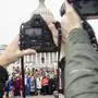 Photographers hold their cameras up as House Speaker Nancy Pelosi of Calif., center, poses with all House Democratic women members of the 116th Congress on the East Front Capitol Plaza on Capitol Hill in Washington, Friday, Jan. 4, 2019, as the 116th Congress begins. (AP Photo/Andrew Harnik)
