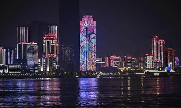 TOPSHOT - A general view of residential and commercial buildings near Yangtze River is pictured in the city of Wuhan, in China's central Hubei province on April 6, 2020. (Photo by Hector RETAMAL / AFP)