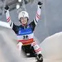 ABD0055_20220116 - OBERHOF - DEUTSCHLAND: 16.01.2022, Thüringen, Oberhof: Madeleine Egle aus Österreich jubelt im Ziel beim Einsitzer der Frauen beim Eberspächer Rennrodel-Weltcup in der Lotto Thüringen Eisarena in Oberhof. Sie gewinnt den Wettbewerb Foto: Martin Schutt/dpa-Zentralbild/dpa +++ dpa-Bildfunk +++. - FOTO: APA/dpa-Zentralbild/Martin Schutt