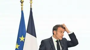 TOPSHOT - France's President Emmanuel Macron makes a speech during a visit to the University of Science and Technology in Hanoi on May 27, 2025. (Photo by NHAC NGUYEN / AFP)