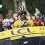 Italy's Jonathan Milan, wearing the best sprinter's green jersey, left, and Slovenia's Tadej Pogacar, wearing the overall leader's yellow jersey, ride behind the race director's car during the ceremonial parade of the eighteenth stage of the Tour de France cycling race over 171.5 kilometers (106.6 miles) with start in Vif and finish in Courchevel Col de la Loze, France, Thursday, July 24, 2025. (AP Photo/Thibault Camus)