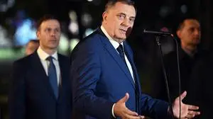 TOPSHOT - Bosnian Serb leader Milorad Dodik (C) delivers a speech flanked by Serbia's President, in Banja Luka, northern Bosnia and Herzegovina, on February 26, 2025, following Milorad Dodik's one year prison sentence. Bosnian Serb leader Milorad Dodik was sentenced on February 26, 2025, to a year in prison in a landmark trial for defying rulings made by an international envoy charged with overseeing the country's peace accords, after signing legislation that refused to recognise decisions made by Bosnia's international high representative, Christian Schmidt, and the constitutional court. (Photo by STRINGER / AFP)