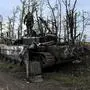 This photograph taken on September 11, 2022, shows a Ukranian soldier standing atop an abandoned Russian tank near a village on the outskirts of Izyum, Kharkiv Region, eastern Ukraine, amid the Russian invasion of Ukraine. - Ukraine forces said that their lightning counter-offensive took back more ground in the past 24 hours, as Russia replied with strikes on some of the recaptured ground. The territorial shifts were one of Russia's biggest reversals since its forces were turned back from Kyiv in the earliest days of the nearly seven months of fighting, yet Moscow signalled it was no closer to agreeing a negotiated peace. (Photo by Juan BARRETO / AFP)