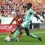 Dundee United's Vicko Sevelj, left, and SK Rapid Vienna's Serge-Philippe Raux-Yao battle for the ball during a UEFA Conference League, third qualifying round, second leg soccer match, Thursday, Aug. 14, 2025, at Tannadice Park, Dundee, Scotland. (Steve Welsh/PA via AP)
