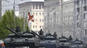 Russian battle tanks roll along the Garden Ring after the Victory Day military parade general rehearsal in Moscow, Russia, Wednesday, May 7, 2025. (AP Photo/Dmitry Serebryakov)