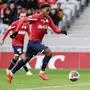 Lille's Canadian forward #09 Jonathan David runs with the ball  during the French Cup football match between Lille LOSC and Golden Lion FC at the Pierre-Mauroy Stadium in Villeneuve-d'Ascq, northern France, on January 6, 2024. (Photo by Sameer Al-DOUMY / AFP)