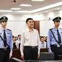This handout photo taken on July 25, 2019 and released by the Shenyang Municipal Intermediate People's Court shows former Chinese governer of Xinjiang Nur Bekri (C) during his trial at the court in Shenyang in northeast China's Liaoning province. - Nur Bekri, the former chairman of China's northwest Xinjiang region, pleaded guilty at a trial on July 25, 2019 to accepting 11.5 million USD in bribes, said the court. (Photo by HANDOUT / Shenyang Municipal Intermediate People's Court / AFP) / -----EDITORS NOTE --- RESTRICTED TO EDITORIAL USE - MANDATORY CREDIT "AFP PHOTO / Shenyang Municipal Intermediate People's Court" - NO MARKETING - NO ADVERTISING CAMPAIGNS - DISTRIBUTED AS A SERVICE TO CLIENTS