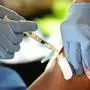 A Jackson-Hinds Comprehensive Health Center nurse administers a Moderna COVID-19 vaccine at an inoculation station next to Jackson State University in Jackson, Miss., Tuesday, July 19, 2022. (AP Photo/Rogelio V. Solis)