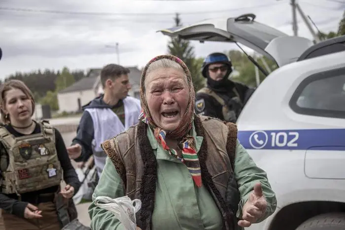 VOVCHANSK, KHARKIV OBLAST, UKRAINE, MAY 15: An elderly reacts during evacuation from the Vovchansk city as the Russia-Ukraine war continues in Kharkiv region, Ukraine on May 15, 2024. Narciso Contreras / Anadolu/ABACAPRESS.COM