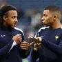(From L) France's defender #05 Jules Kounde and France's forward #10 Kylian Mbappe speak before the UEFA Euro 2024 quarter-final football match between Portugal and France at the Volksparkstadion in Hamburg on July 5, 2024. (Photo by FRANCK FIFE / AFP)