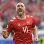 TOPSHOT - Denmark's midfielder #10 Christian Eriksen celebrates scoring his team's first goal during the UEFA Euro 2024 Group C football match between Slovenia and Denmark at the Stuttgart Arena in Stuttgart on June 16, 2024. (Photo by DAMIEN MEYER / AFP)