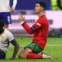Portugal's forward #07 Cristiano Ronaldo (R) and France's defender #04 Dayot Upamecano react during the UEFA Euro 2024 quarter-final football match between Portugal and France at the Volksparkstadion in Hamburg on July 5, 2024. (Photo by FRANCK FIFE / AFP)