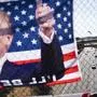 A flag displaying Republican presidential candidate former President Donald Trump hangs over a Highway 24 overpass in Lafayette, Calif., Sunday, July 14, 2024. (Minh Connors/San Francisco Chronicle via AP)