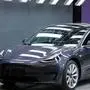 A Tesla Model 3 car is displayed during the Tesla China-made Model 3 Delivery Ceremony in Shanghai. - Tesla CEO Elon Musk presented the first batch of made-in-China cars to ordinary buyers on January 7, 2020 in a milestone for the company's new Shanghai "giga-factory", but which comes as sales decelerate in the world's largest electric-vehicle market. (Photo by STR / AFP) / China OUT