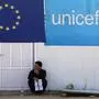 A Syrian refugee holds a pamphlet as he waits to register his name at the Zaatari office for employment on October 4, 2017 at the Zaatari refugee camp, 80 kilometers (50 miles) north of the capital Amman. Around 50 companies at the EU-financed job fair, which Jordan's government and the United Nations refugee agency UNHCR opened on August 20, have been compiling lists of applicants by name, age and qualification. (Photo by KHALIL MAZRAAWI / AFP)