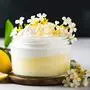 Elder flower dessert in a glass jar with lemon curd and fresh flowers With copyspace for text