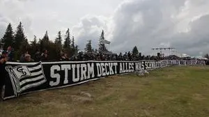 SANKT RADEGUND,AUSTRIA,01.MAY.22 - SOCCER - ADMIRAL Bundesliga, SK Sturm Graz, Sturm auf den Schoeckl. Image shows fans of Sturm with a banner.
Photo: GEPA pictures/ Chris Bauer