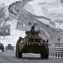 A convoy of Russian armored vehicles moves along a highway in Crimea, Tuesday, Jan. 18, 2022. Russia has concentrated an estimated 100,000 troops with tanks and other heavy weapons near Ukraine in what the West fears could be a prelude to an invasion. The Biden administration is unlikely to answer a further Russian invasion of Ukraine by sending U.S. combat troops. But it could pursue a range of less dramatic yet still risky options, including giving military support to a post-invasion Ukrainian resistance. (AP Photo)