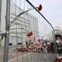 A view of a makeshift memorial in front of the burnt-out Crocus City Hall concert venue in Krasnogorsk, outside Moscow, on March 26, 2024. At least 139 people were killed when gunmen in camouflage stormed Crocus City Hall, shooting spectators before setting the building on fire in the most fatal attack in Europe to have been claimed by Islamic State jihadists. (Photo by NATALIA KOLESNIKOVA / AFP)