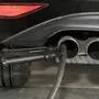 (FILES) In this file photo taken on August 7, 2017 a hose for an emission test is fixed in the exhaust pipe of a Volkswagen Golf 2,0 litre diesel car at the Technical Inspection Agency in Ludwigsburg, southwestern Germany. The German government on January 29, 2018 strongly condemned revelations that three carmakers had tested the effects of diesel fumes on monkeys and humans, adding that it had asked BMW, Volkswagen and Daimler to explain themselves. / AFP PHOTO / THOMAS KIENZLE,sujet vw, volkswagen, abgase, abgastest, abgastests