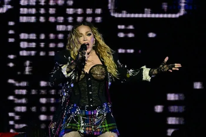 US pop star Madonna performs onstage during a free concert at Copacabana beach in Rio de Janeiro, Brazil, on May 4, 2024. . Madonna ended her The Celebration Tour with a performance attended by some 1.5 million enthusiastic fans. (Photo by Pablo PORCIUNCULA / AFP)