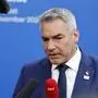 Austria's Chancellor Karl Nehammer answers journalists questions upon arrival for the European Political Community Summit in Budapest, on November 7, 2024. (Photo by Ludovic MARIN / AFP)