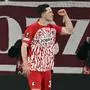 Freiburg's Austrian forward #38 Michael Gregoritsch celebrates after scoring a goal with fans during the UEFA Europa League round of 16 first leg football match between SC Freiburg and West Ham United FC in Freiburg, southwestern Germany on March 7, 2024. (Photo by THOMAS KIENZLE / AFP)