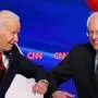 (FILES) In this file photo taken on March 15, 2020 Democratic presidential hopefuls former US vice president Joe Biden (L) and Senator Bernie Sanders greet each other with a safe elbow bump before the start of the 11th Democratic Party 2020 presidential debate in a CNN Washington Bureau studio in Washington, DC. - Sen. Bernie Sanders, the independent senator from Vermont who ended his presidential bid April 8, 2020, said on a live stream hosted by former vice president Joe Biden on April 13, 2020 that he was endorsing Biden, the presumptive Democratic presidential nominee. (Photo by Mandel NGAN / AFP)