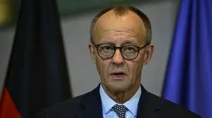 German Chancellor Friedrich Merz delivers a statement at the Chancellery in Berlin, Germany, after a hotly-contested pensions bill passed Germany's Bundestag, the lower house of parliament, on December 5, 2025. The bill, which passed with 319 voting in favour, had become a key point of contention in the government, with Merz having to balance the demands of his leftist SDU coalition partners with younger members of his conservative CDU/CSU alliance. (Photo by John MACDOUGALL / AFP)