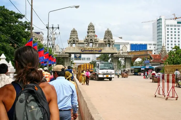 Aranyaprathet, Thailand - July 13 2006: Tourists queuing to pass the PoiPet International Border and enter Cambodia.   xkwx Aranyaprathet Thailand Tourists queuing Poipet International Border Cambodia Poipet Travel Destinations journey custom border asia southeast asia casino