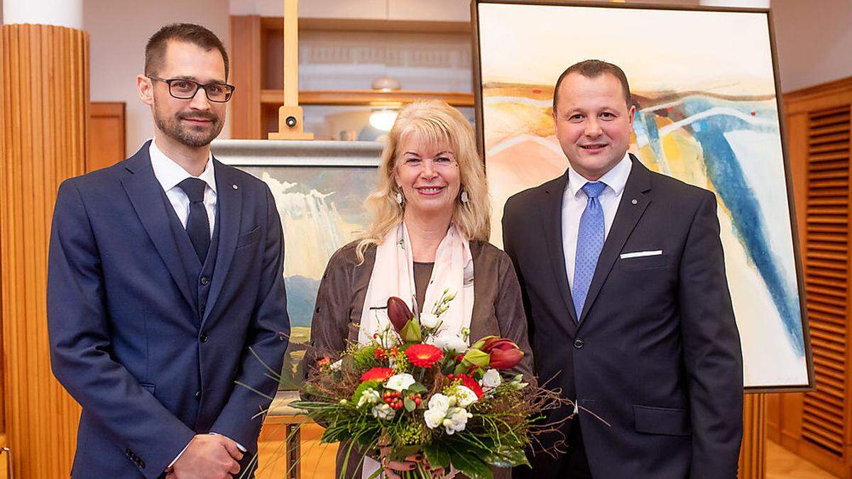 Philipp Glanzl, Präsident des Round Table 21, Ursula Strobl und Auktionator Stefan Taferner 