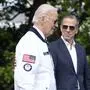 FILE - President Joe Biden, wearing a Team USA jacket and walking with his son Hunter Biden, heads toward Marine One on the South Lawn of the White House in Washington, July 26, 2024. (AP Photo/Susan Walsh, File)