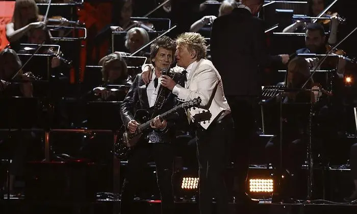 Rod Stewart and Ronnie Wood perform on stage at the Brit Awards 2020 in London, Tuesday, Feb. 18, 2020. (Photo by Joel C Ryan/Invision/AP)