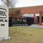 FILE - A security guard stands outside the Glock, Inc. headquarters, Oct. 8, 2014, in Smyrna, Ga. The city of Chicago sued Glock Inc. on Tuesday, March 19, 2024, alleging the handgun manufacturer is facilitating the proliferation of illegal machine guns that can fire as many as 1,200 rounds per minute on the streets of the city. (AP Photo/David Goldman, File)
