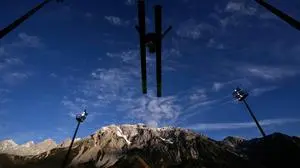 Ida Marie Hagen, of Norway, soars through the air during the women's Individual Gundersen Normal Hill/5Km event, at the Nordic Combined World Cup in Ramsau am Dachstein, Austria, Saturday, Dec. 20, 2025. (AP Photo/Matthias Schrader)