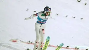 Stephan Embacher, of Austria, lands his qualification jump at the second stage of the Four Hills ski jumping tournament in Garmisch-Partenkirchen, Germany, Wednesday, Dec. 31, 2025. (AP Photo/Matthias Schrader)