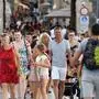 People walk in the centre of Zadar, on the Adriatic coast on August 6, 2020. - A large number of tourists visited the Zadar Riviera, regardless of the novel coronavirus pandemic. Tourism is very important for Croatia, as almost 20% of GDP comes from it. (Photo by Denis LOVROVIC / AFP)