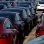 (FILES) In this file photo taken on April 20, 2020 newly manufactured Tesla electric cars are pictured in a storage area at The Western Docks in Southampton on April 20, 2020, as life in Britain continues during the nationwide lockdown to combat the novel coronavirus pandemic. - Britain's battered automotive sector, already beset with Brexit woes, is struggling to restart from the coronavirus crisis with some 2,000 jobs axed on Thursday in the face of slumping sales. (Photo by ADRIAN DENNIS / AFP)