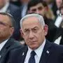 Israeli Prime Minister Benjamin Netanyahu (C), and Jerusalem Mayor Moshe Leon (L) attend the annual ceremony on the eve of Israel’s Remembrance Day for fallen soldiers (Yom HaZikaron) at the Yad LaBanim Memorial in Jerusalem on April 29, 2025. (Photo by Abir SULTAN / POOL / AFP)