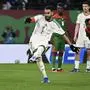 Algeria's forward #7 Riyad Mahrez (L) shoots and scores his team's first goal from the penalty spot during the Africa Cup of Nations (CAN) Group E football match between Algeria and Burkino Faso at Moulay Hassan Stadium in Rabat on December 28, 2025. (Photo by Paul ELLIS / AFP)