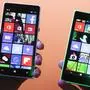 A man shows the new Lumia 830, left, and 730, right, smart phones during a Microsoft Nokia  presentation event at the consumer electronic fair IFA in Berlin, Thursday, Sept. 4, 2014. (AP Photo/Markus Schreiber)