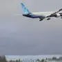 A Boeing 777X airplane flies after taking off on its first flight at Paine Field, Saturday, Jan. 25, 2020, in Everett, Wash. (AP Photo/Ted S. Warren)
