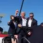 BUTLER, PENNSYLVANIA - July 13: Former president Donald Trump raises his arm with blood on his face during a campaign rally for former President Donald Trump at Butler Farm Show Inc. on Saturday, July 13, 2024 in Butler, Pa. Trump ducked and was taken offstage after loud noises were heard after he began speaking. 
(Photo by Jabin Botsford/The Washington Post via Getty Images)