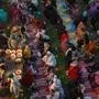 Volunteers distribute free food as Muslim devotees gather to break their fast during the Islamic holy month of Ramadan in Lahore on March 13, 2024. (Photo by Arif ALI / AFP)
