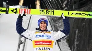 Winner Stefan Kraft of Austria celebrates after the Men's Ski Jumping World Cup, normal hill at the Lugnet Stadium in Falun, Sweden, Tuesday Nov. 25, 2025. (Fredrik Sandberg/TT via AP)