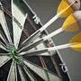 Three darts in the target center on background