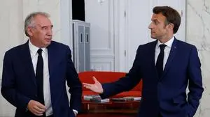 (FILES) France's centrist Democratic Movement (MoDem) party leader Francois Bayrou (L) looks at France's President Emmanuel Macron after talks at the presidential Elysee Palace, in Paris, on June 21, 2022, two days after France's legislative elections. "I won't be joining the government", following a lack of "profound agreement on the policy to be followed", Francois Bayrou told AFP on February 7, 2024. (Photo by Ludovic MARIN / POOL / AFP)